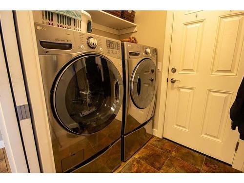 37 Bluebird Drive Se, Didsbury, AB - Indoor Photo Showing Laundry Room