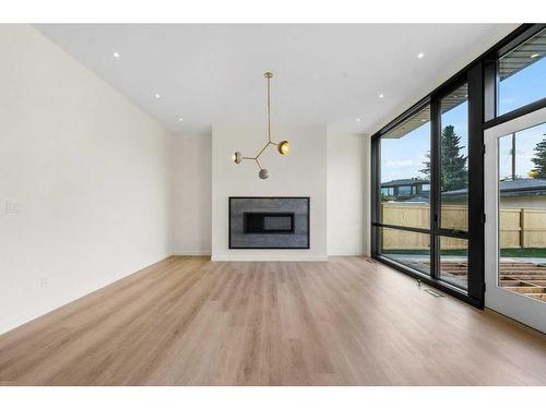 3C Willow Crescent Sw, Calgary, AB - Indoor Photo Showing Living Room With Fireplace