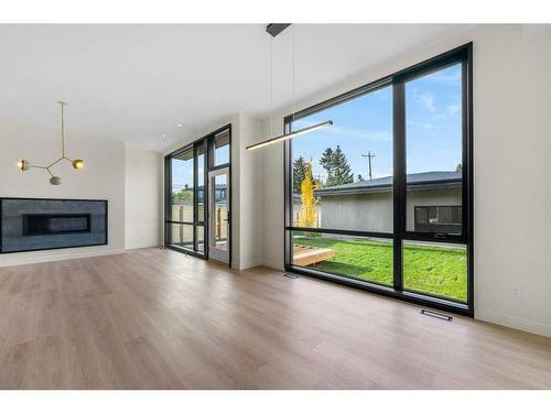 3C Willow Crescent Sw, Calgary, AB - Indoor Photo Showing Living Room With Fireplace