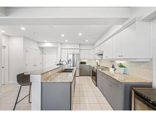 2307-10221 Tuscany Boulevard Nw, Calgary, AB - Indoor Photo Showing Kitchen With Double Sink With Upgraded Kitchen