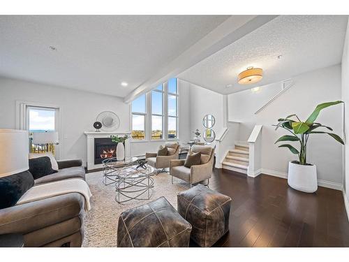 2307-10221 Tuscany Boulevard Nw, Calgary, AB - Indoor Photo Showing Living Room With Fireplace