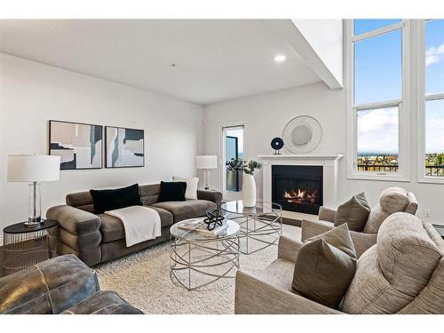 2307-10221 Tuscany Boulevard Nw, Calgary, AB - Indoor Photo Showing Living Room With Fireplace