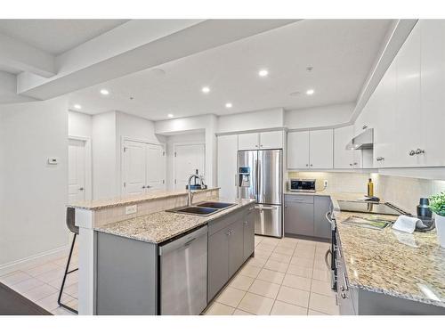 2307-10221 Tuscany Boulevard Nw, Calgary, AB - Indoor Photo Showing Kitchen With Double Sink With Upgraded Kitchen