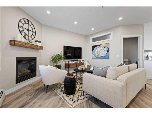 5311-14645 6 Street Sw, Calgary, AB - Indoor Photo Showing Living Room With Fireplace