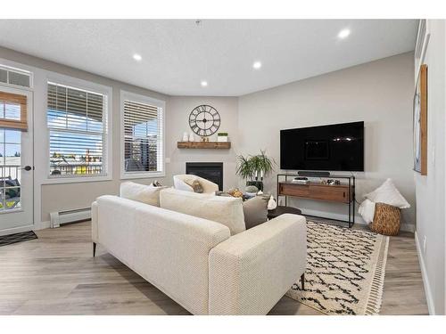 5311-14645 6 Street Sw, Calgary, AB - Indoor Photo Showing Living Room With Fireplace