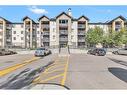 8317-304 Mackenzie Way Sw, Airdrie, AB  - Outdoor With Balcony With Facade 