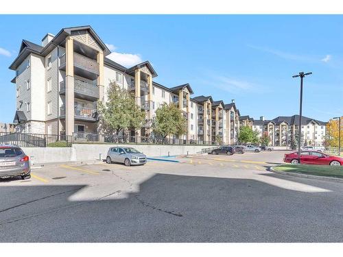 8317-304 Mackenzie Way Sw, Airdrie, AB - Outdoor With Balcony With Facade