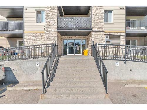 8317-304 Mackenzie Way Sw, Airdrie, AB - Outdoor With Balcony With Exterior