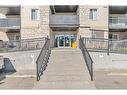 8317-304 Mackenzie Way Sw, Airdrie, AB  - Outdoor With Balcony With Exterior 