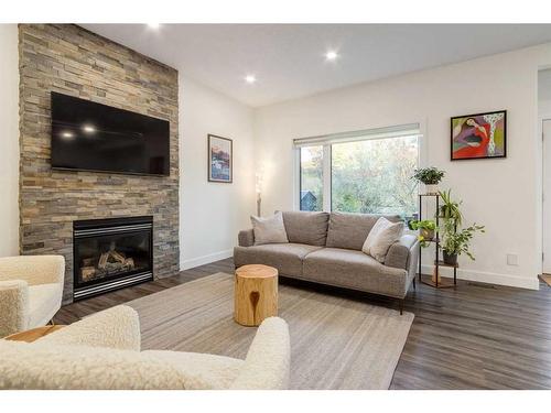 94 Discovery Ridge Gardens Sw, Calgary, AB - Indoor Photo Showing Living Room With Fireplace