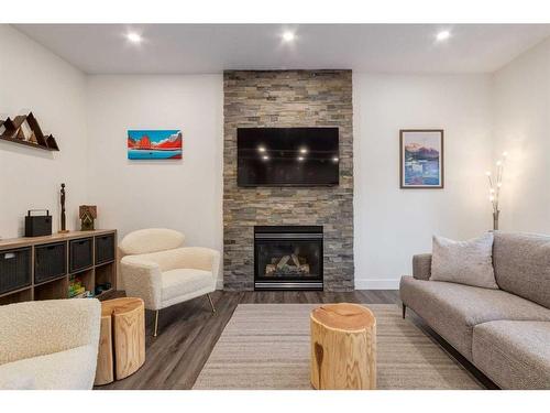 94 Discovery Ridge Gardens Sw, Calgary, AB - Indoor Photo Showing Living Room With Fireplace