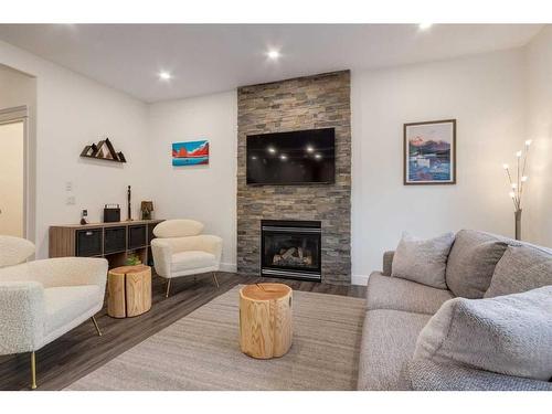 94 Discovery Ridge Gardens Sw, Calgary, AB - Indoor Photo Showing Living Room With Fireplace