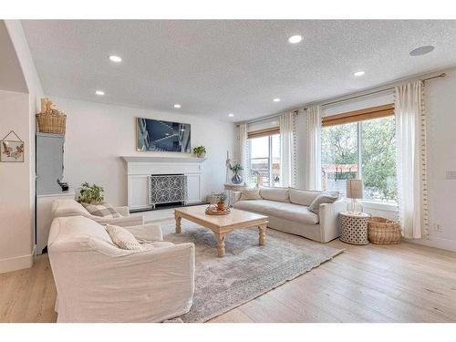 41 Strathlea Court Sw, Calgary, AB - Indoor Photo Showing Living Room With Fireplace