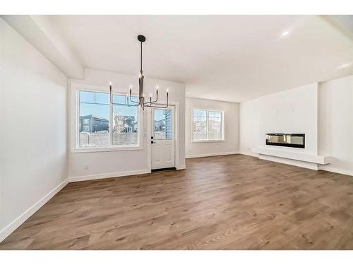 166 Amblehurst Way Nw, Calgary, AB - Indoor With Fireplace