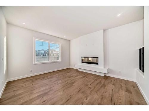 166 Amblehurst Way Nw, Calgary, AB - Indoor Photo Showing Other Room With Fireplace