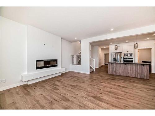 166 Amblehurst Way Nw, Calgary, AB - Indoor Photo Showing Living Room With Fireplace