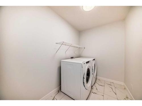 166 Amblehurst Way Nw, Calgary, AB - Indoor Photo Showing Laundry Room