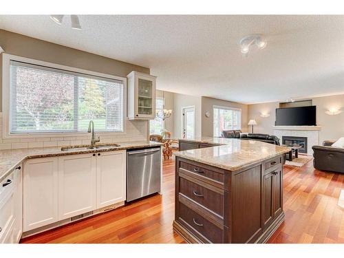 28 Simcrest Point Sw, Calgary, AB - Indoor Photo Showing Kitchen With Fireplace With Double Sink