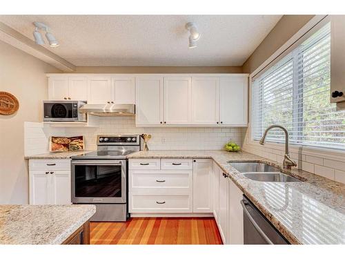 28 Simcrest Point Sw, Calgary, AB - Indoor Photo Showing Kitchen With Double Sink