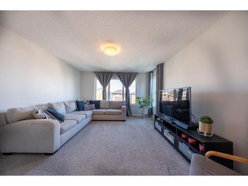 145 Belmont Villas Sw, Calgary, AB - Indoor Photo Showing Living Room