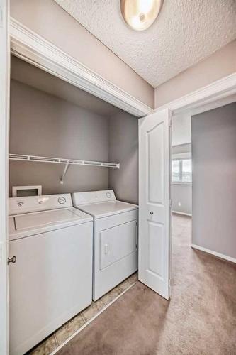 63 Evanston Rise Nw, Calgary, AB - Indoor Photo Showing Laundry Room