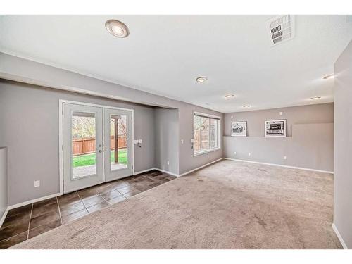 63 Evanston Rise Nw, Calgary, AB - Indoor Photo Showing Other Room With Fireplace