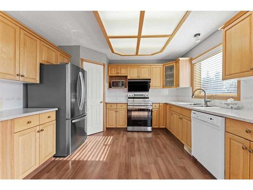 416 Scenic View Bay Nw, Calgary, AB - Indoor Photo Showing Kitchen With Double Sink