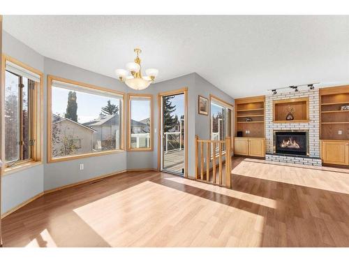 416 Scenic View Bay Nw, Calgary, AB - Indoor Photo Showing Living Room With Fireplace