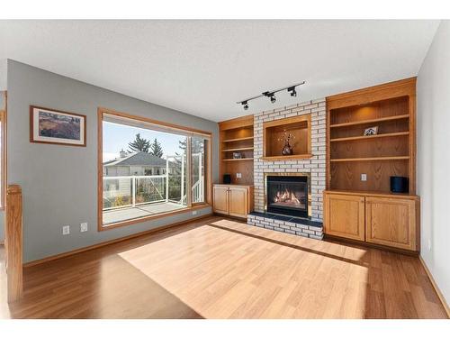 416 Scenic View Bay Nw, Calgary, AB - Indoor Photo Showing Living Room With Fireplace