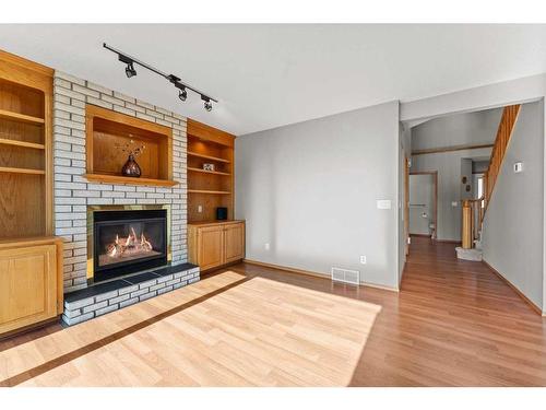 416 Scenic View Bay Nw, Calgary, AB - Indoor Photo Showing Living Room With Fireplace