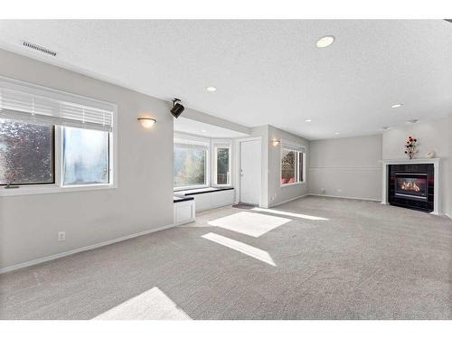 416 Scenic View Bay Nw, Calgary, AB - Indoor With Fireplace