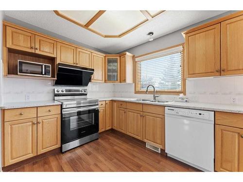 416 Scenic View Bay Nw, Calgary, AB - Indoor Photo Showing Kitchen With Double Sink