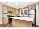 18-175 Manora Place Ne, Calgary, AB  - Indoor Photo Showing Kitchen With Stainless Steel Kitchen 