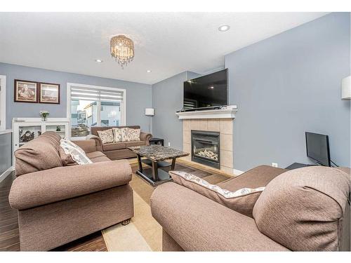 151 Saddlehorn Close Ne, Calgary, AB - Indoor Photo Showing Living Room With Fireplace