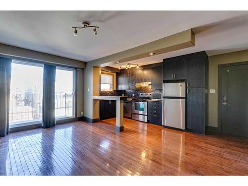 303-1736 13 Avenue Sw, Calgary, AB - Indoor Photo Showing Kitchen With Stainless Steel Kitchen