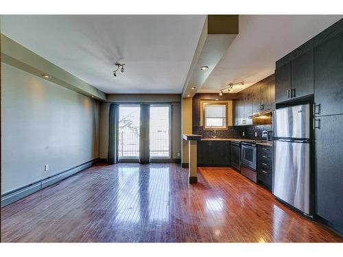 303-1736 13 Avenue Sw, Calgary, AB - Indoor Photo Showing Kitchen With Stainless Steel Kitchen