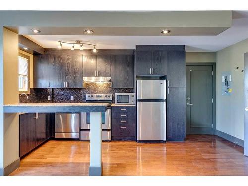 303-1736 13 Avenue Sw, Calgary, AB - Indoor Photo Showing Kitchen With Stainless Steel Kitchen