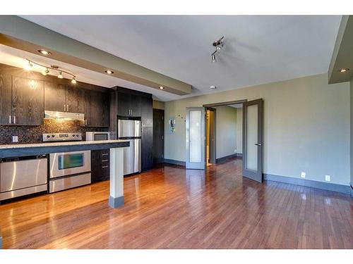 303-1736 13 Avenue Sw, Calgary, AB - Indoor Photo Showing Kitchen With Stainless Steel Kitchen