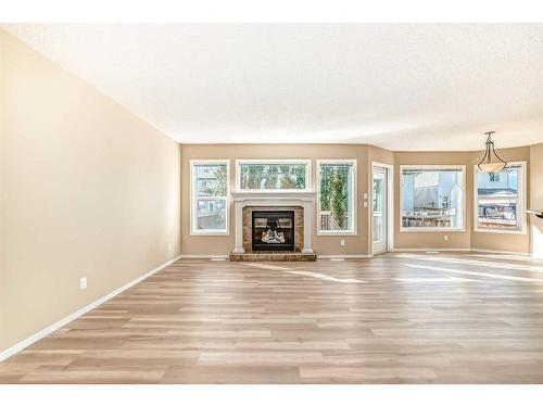 273 New Brighton Lane Se, Calgary, AB - Indoor Photo Showing Living Room With Fireplace