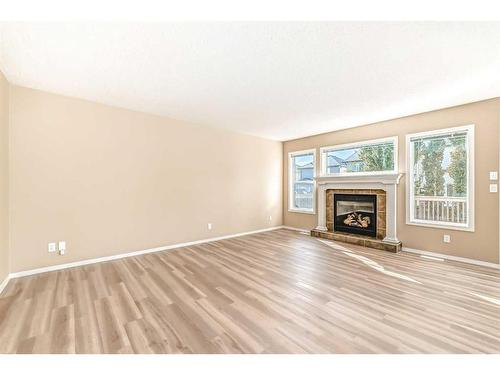 273 New Brighton Lane Se, Calgary, AB - Indoor Photo Showing Living Room With Fireplace