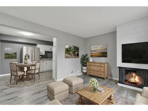 5-6408 4A Street Ne, Calgary, AB - Indoor Photo Showing Living Room With Fireplace