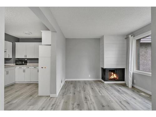 5-6408 4A Street Ne, Calgary, AB - Indoor With Fireplace