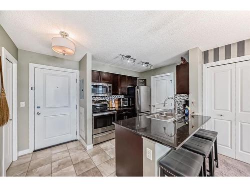 415-15 Saddlestone Way Ne, Calgary, AB - Indoor Photo Showing Kitchen With Stainless Steel Kitchen With Double Sink