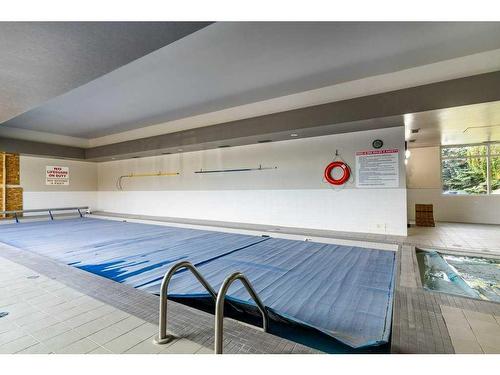 2414 Edenwold Heights Nw, Calgary, AB - Indoor Photo Showing Other Room With In Ground Pool