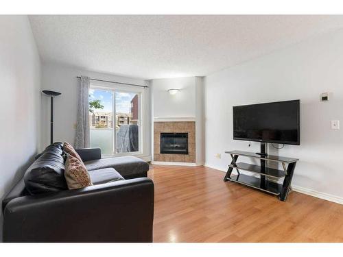 2414 Edenwold Heights Nw, Calgary, AB - Indoor Photo Showing Living Room With Fireplace