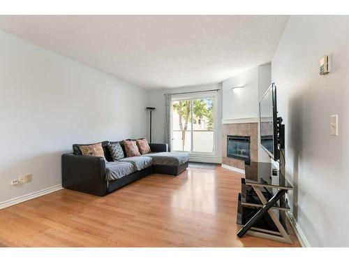 2414 Edenwold Heights Nw, Calgary, AB - Indoor Photo Showing Living Room With Fireplace