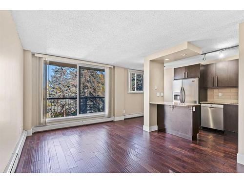 301-1231 17 Avenue Nw, Calgary, AB - Indoor Photo Showing Kitchen With Stainless Steel Kitchen