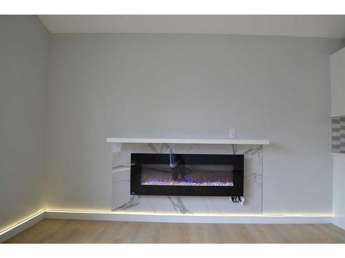 6320 Tregillus Street Nw, Calgary, AB - Indoor Photo Showing Living Room With Fireplace