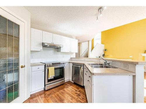 185 Arbour Stone Close Nw, Calgary, AB - Indoor Photo Showing Kitchen With Stainless Steel Kitchen With Double Sink