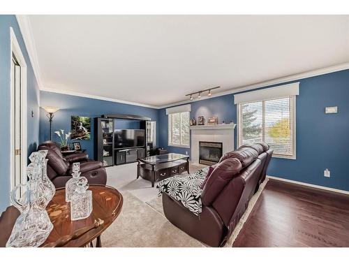 43 Scimitar Point Nw, Calgary, AB - Indoor Photo Showing Living Room With Fireplace